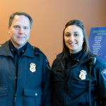 Two Menasha police officers smiling